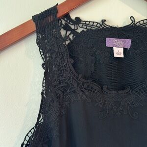 Black sleeveless blouse with lace detail
